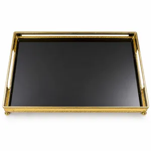 gilded bronze dresser tray with a black glass base