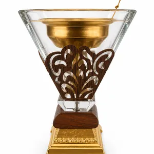 bakhoor incense burner features a gold and clear glass