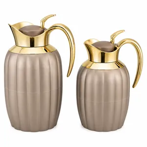 beige and gold thermos set
