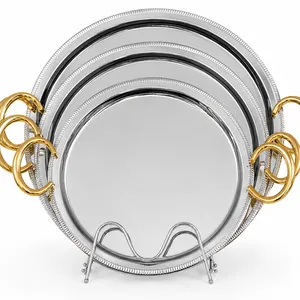 oval silver-plated serving tray with decorative gold-toned handles