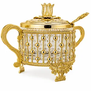 Ornate Gold Sugar Bowl with Lid Spoon Glass Insert Double Handle Footed
